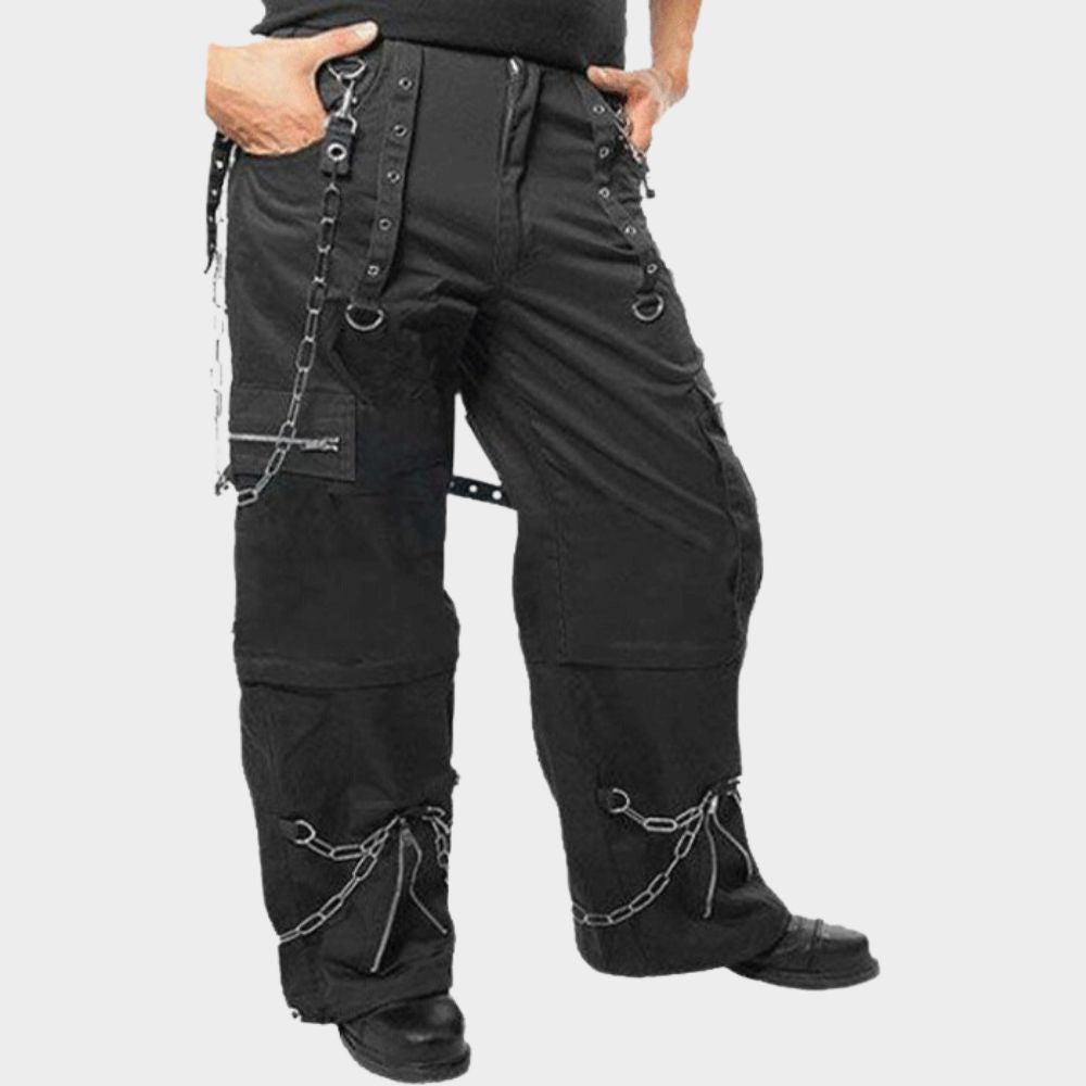 Black cotton bondage cargo pants with multiple cargo pockets and buckled straps for a cyber goth aesthetic.