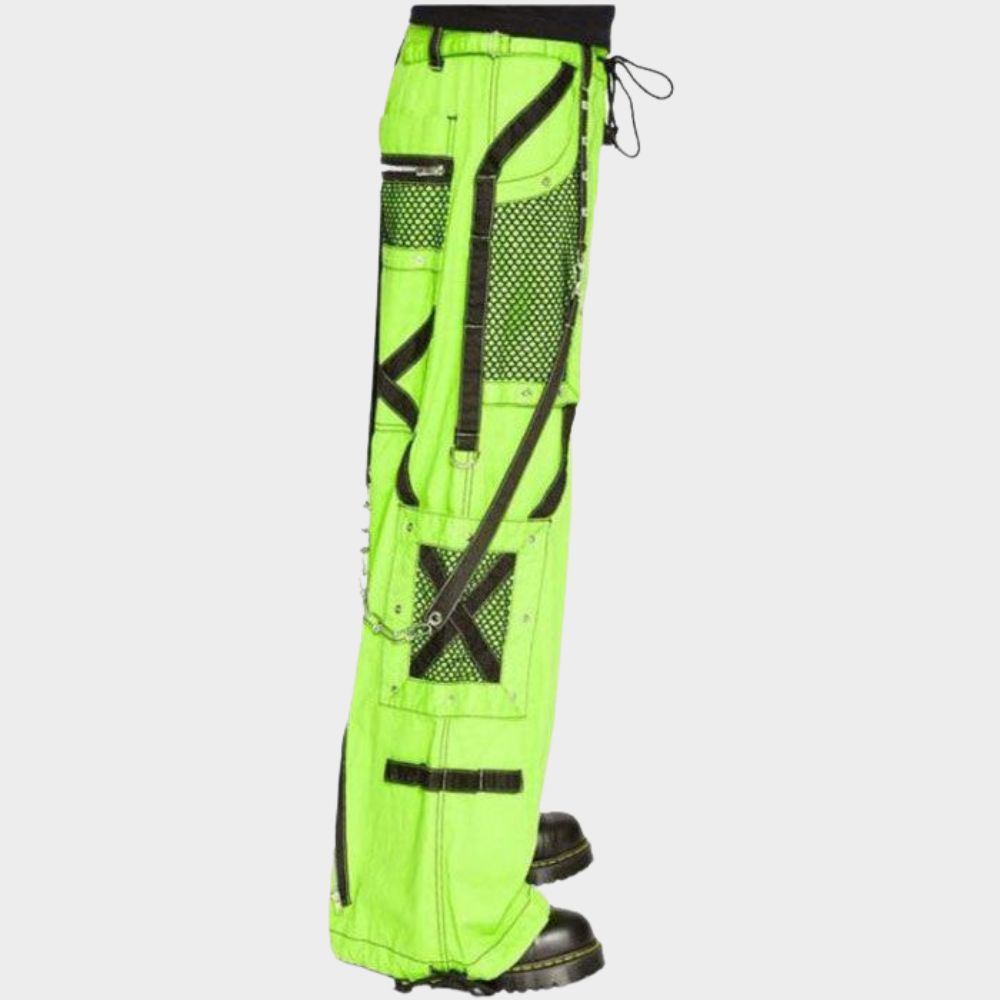 Close-up view of a model in action, highlighting the neon green wide-leg cargo pants with black mesh pockets. The image showcases the fixed strap detail and adjustable waist, emphasizing the comfort and functionality of these gothic-inspired pants.