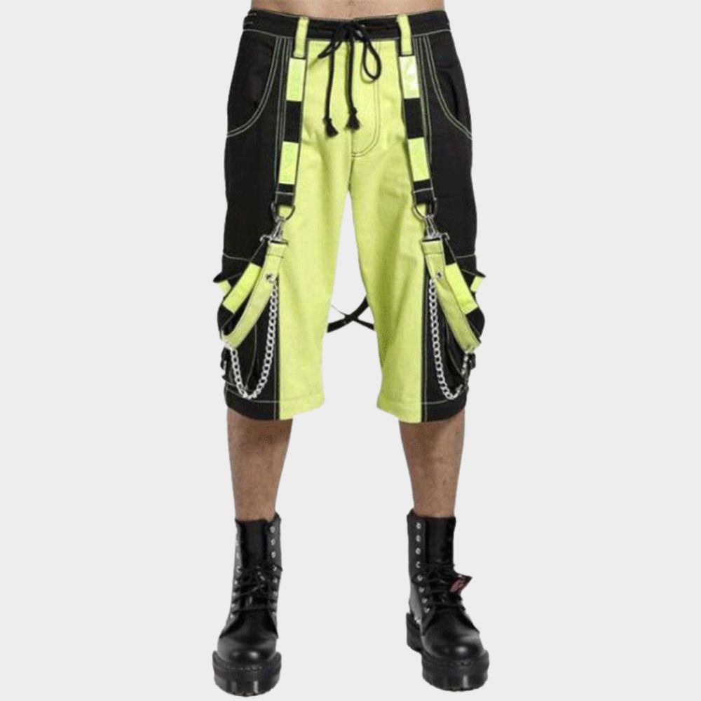 Model wearing black and lime green reflective gothic pants with adjustable waist.
