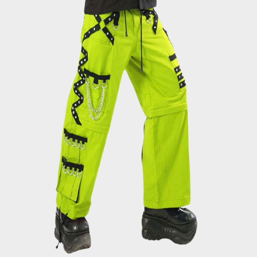 Close-up of fluorescent parrot green unisex cargo pants highlighting cargo pockets, metallic chains, and black straps for a bold gothic electro look.