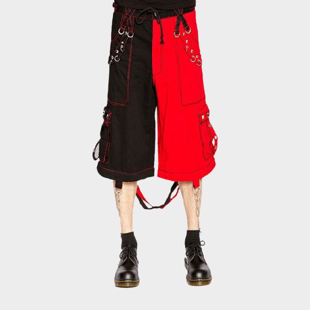 Model wearing black and red punk cargo pants with removable silver chains and D-rings for customization.